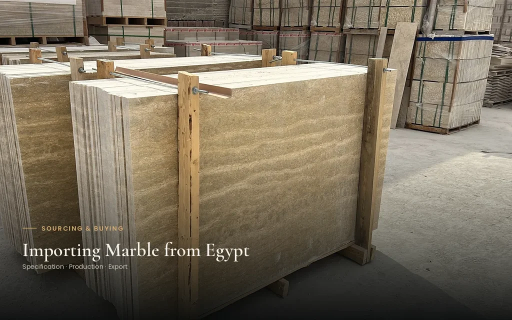 Beige stone slabs held upright between timber supports in a storage yard, with the title Importing Marble from Egypt.