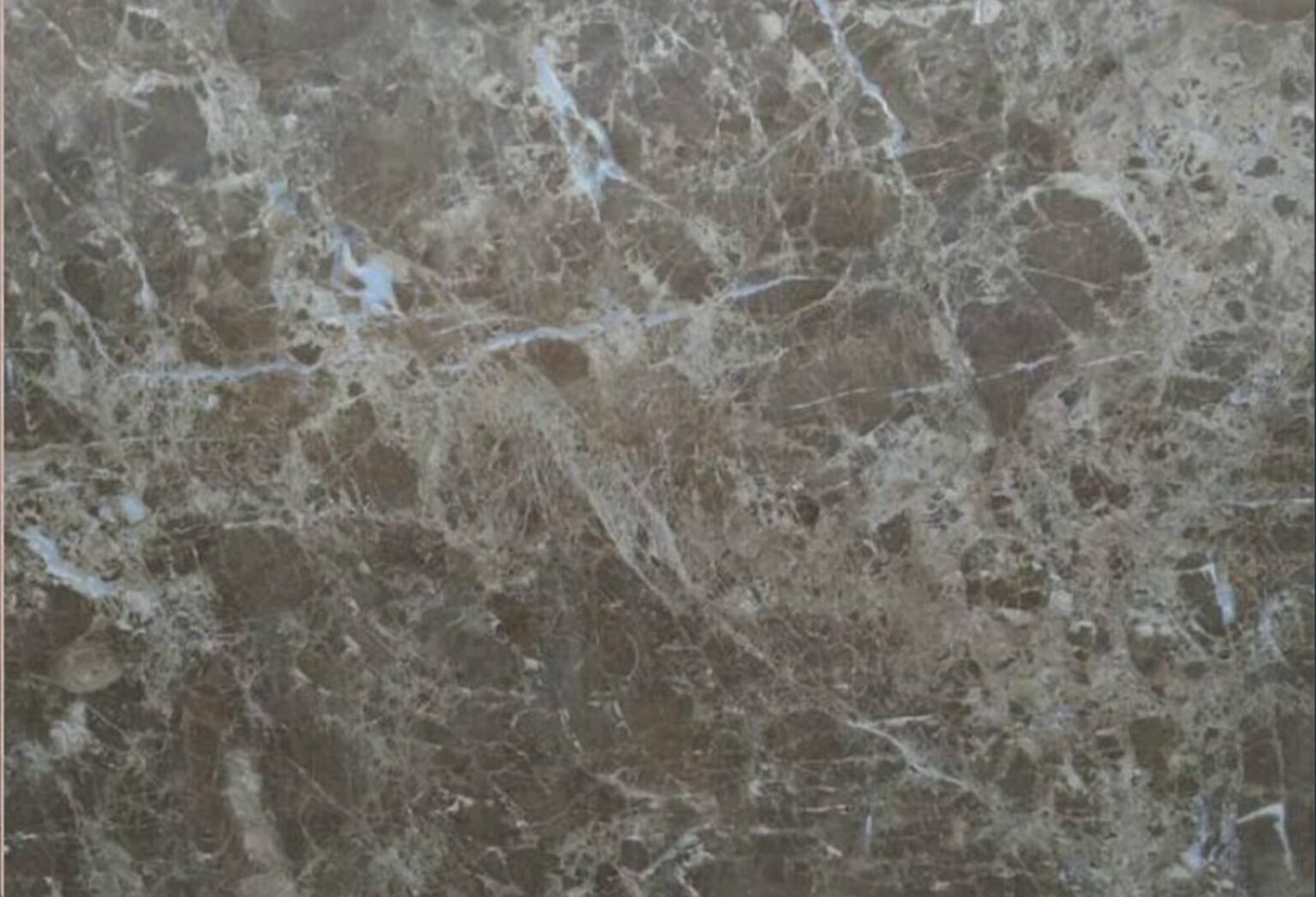 Polished Emperador Egyptian marble surface with natural veining