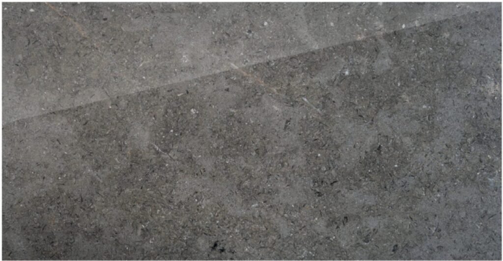 Triesta Grey marble surface: mid grey with small darker flecks.